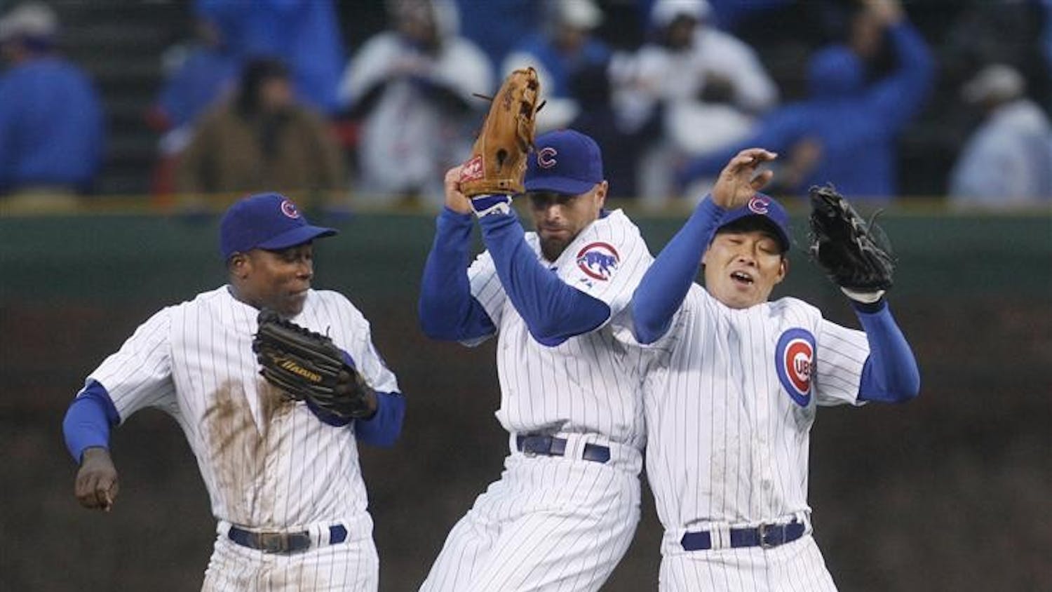 Chicago Cubs outfielders Alfonso Soriano, Reed Johnson, and Kosuke Fukudome celebrate the Cubs' 4-0 win over the Colorado Rockies after a baseball game at Wrigley Field Monday in Chicago. 