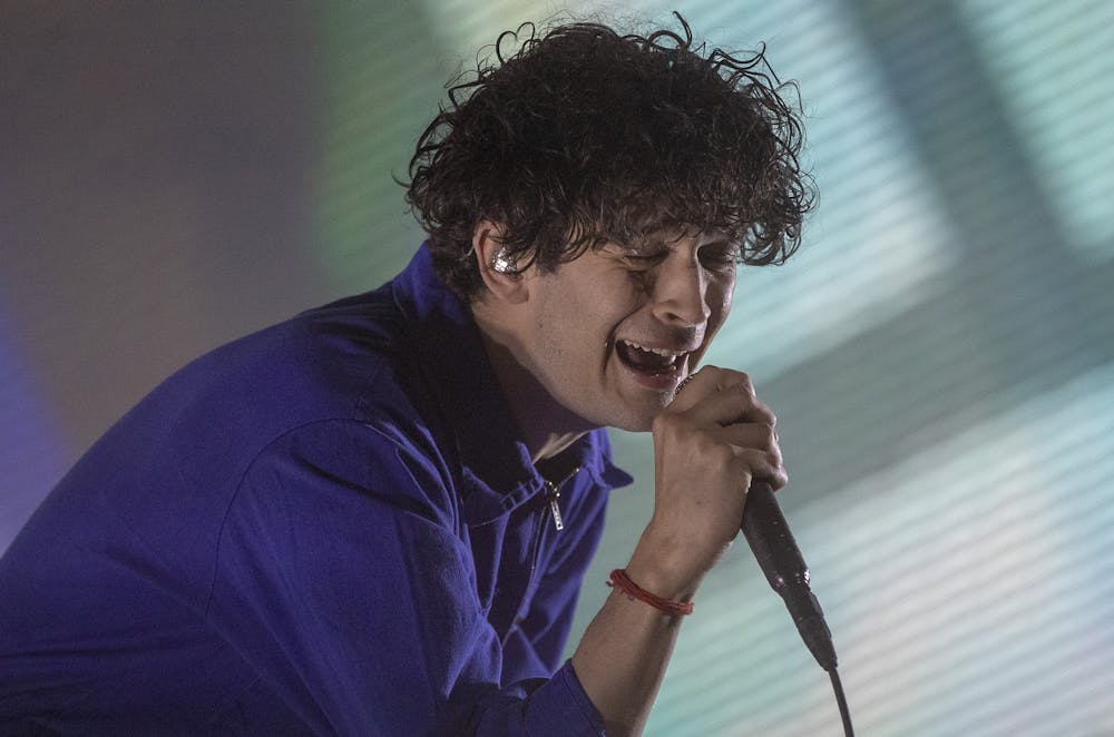 Singer Matty Healy of The 1975 sings onstage during opening day at the Coachella Valley Music and Arts Festival on April 12 on the Empire Polo Club grounds in Indio, California.