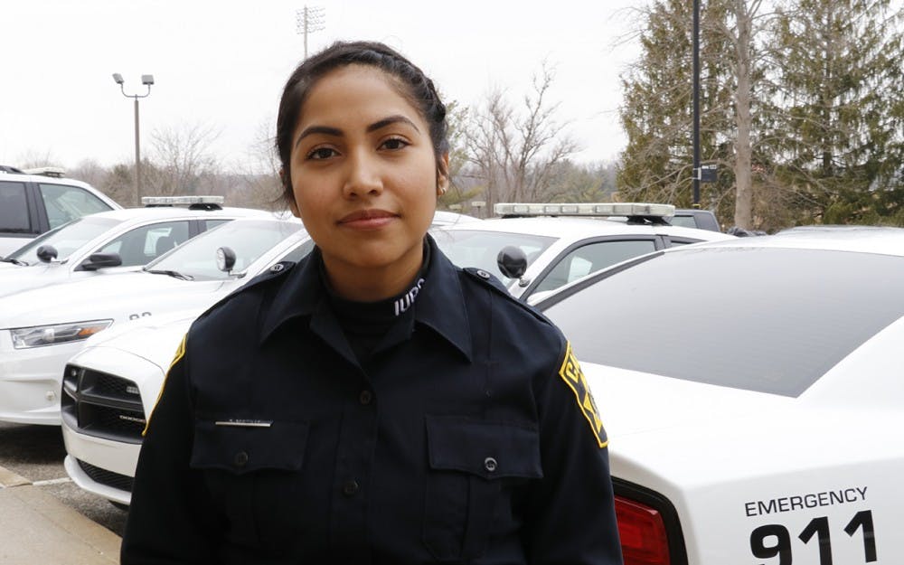 IU Police Department cadet and senior Karla Castillo on her way out of the police department. Cadets meet at IUPD to pick up their radios before starting their security shifts on campus.