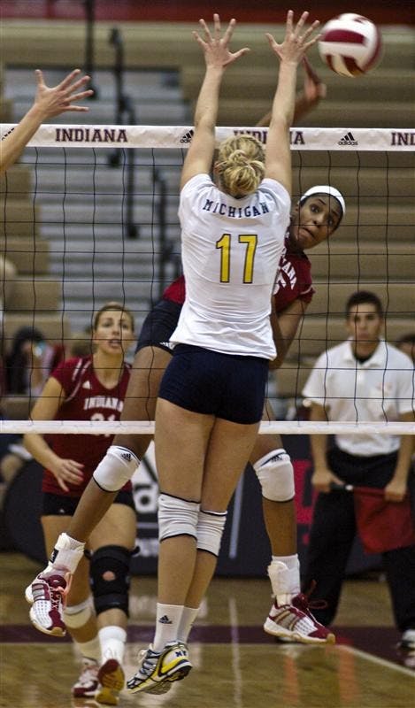 Erica Short spikes the ball late in the second set during the IU-Michigan Volleyball match Saturday at University Gymnasium. The event, entitled Hoosiers Dig out Cancer, helped raise money for cancer research.