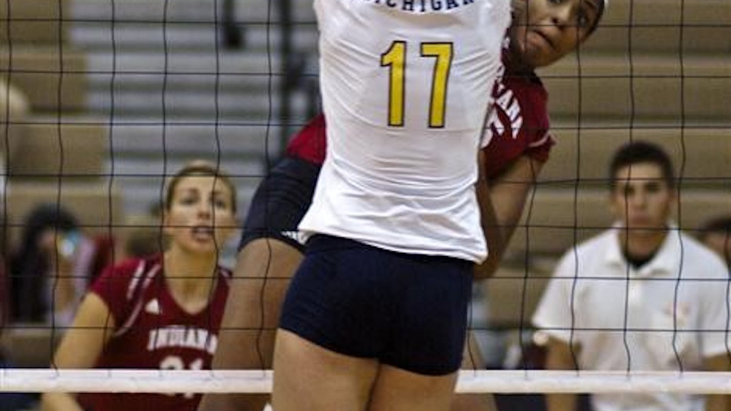 Erica Short spikes the ball late in the second set during the IU-Michigan Volleyball match Saturday at University Gymnasium. The event, entitled Hoosiers Dig out Cancer, helped raise money for cancer research.