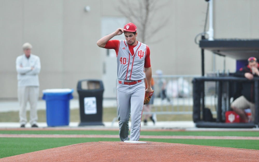 Junior Brian Hobbie walks to the mound during game 2 on Saturday at Rocky and Bernice Miller Park. Hobbie threw a complete game, which IU won 6-5.
