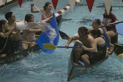 Students play competitive battleship in the pool at the Student Recreational Sports Center in Feb. 2014. The SRSC will reopen Aug. 28, and the Bill Garrett Fieldhouse Sept. 7, with safety changes in place to prevent the spread of the coronavirus.