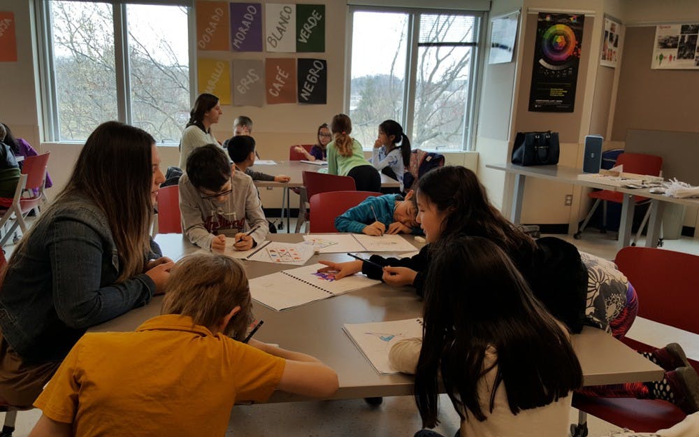 Students work on crafts during the "Art of Language" workshop. These crafts&nbsp;aimed to help&nbsp;them acquire Spanish language skills.