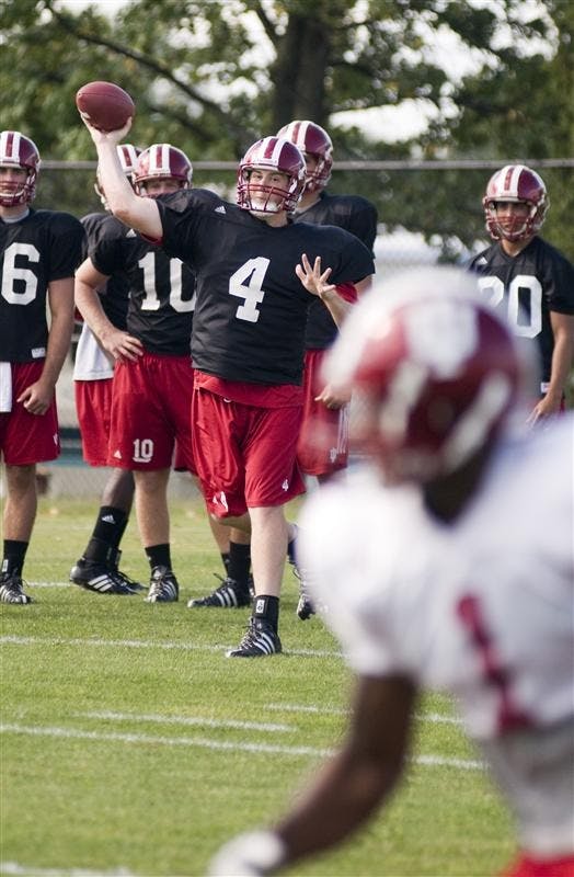 IU quarterback Ben Chappell eyes receiver Terrance Turner before letting it fly during practice on Tuesday at the football practice field.