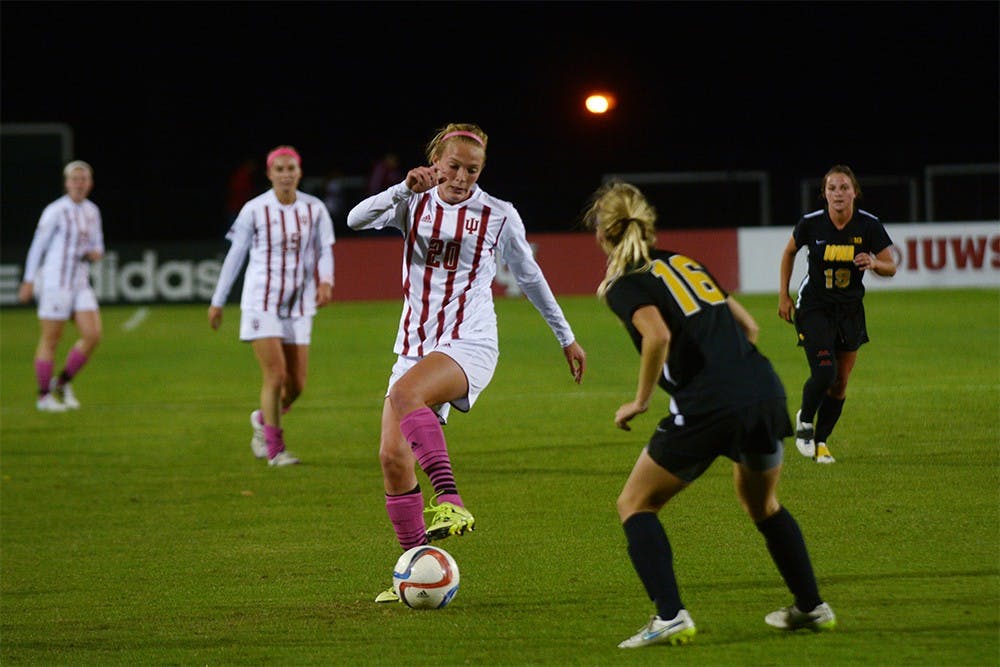 Freshman defender Caroline Dreher works aournd an Iowa defender during the game on Oct. 3 at Bill Armstrong Stadium. The game ended 0-0. 