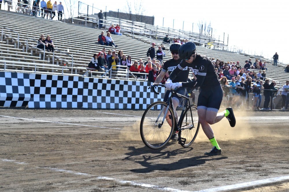 <p>Cutters teammates transition riders during their run March 23 at the Little 500 Qualifications. Cutters was the top qualifier for the men&#x27;s Little 500 race.</p>