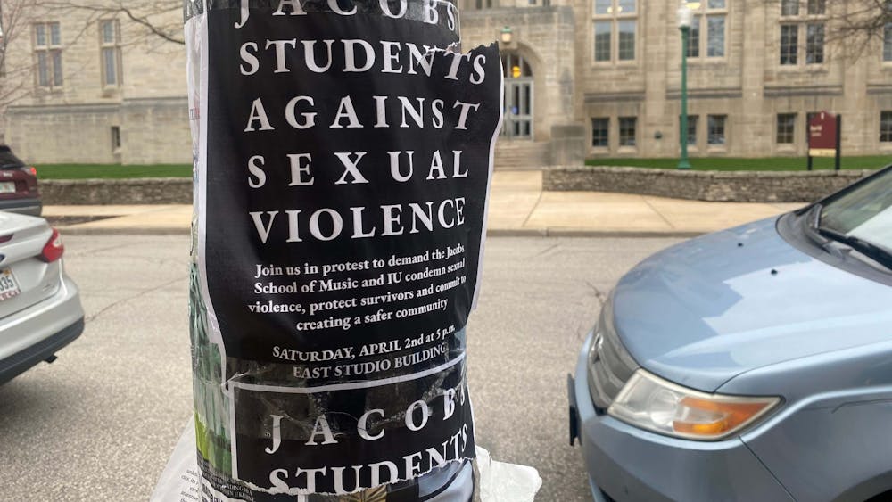 Protest flyers are seen taped on an Indiana Avenue utility pole March 31, 2022. Organizers hung multiple flyers around campus to spread word of Saturday’s event at the East Studio Building. Some of those flyers have been torn down and defaced with offensive writing.