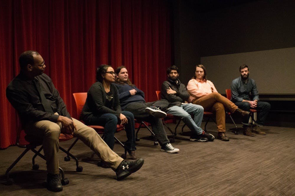 <p>Graduate Media School filmmakers answer audience questions after their work was featured Nov. 2 in the Moving Image Archive Screening Room at Wells Library.</p>
