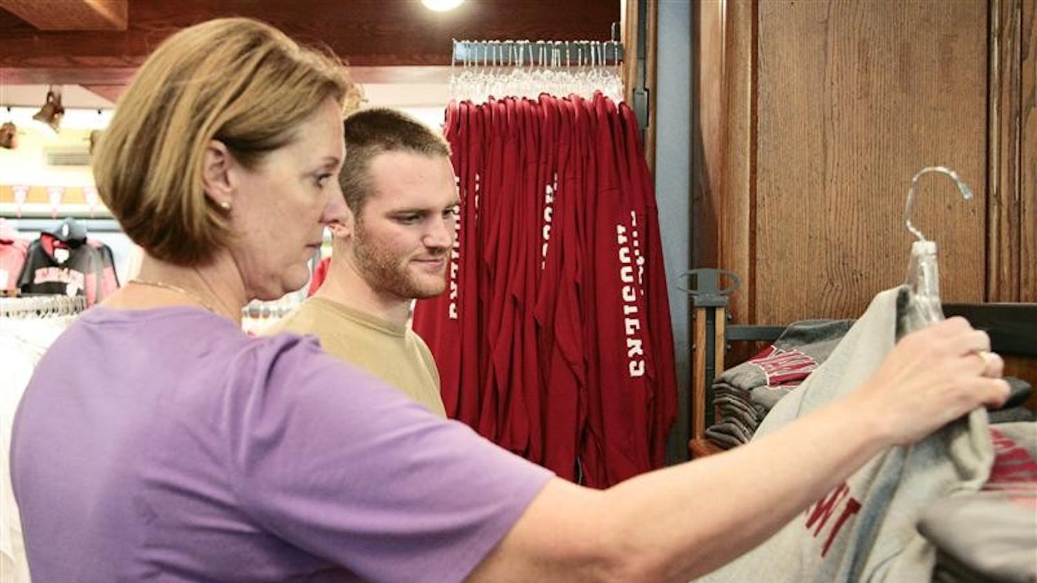 Incoming freshman Nathan Miller and his mother Betsy Miller browse IU merchandise Wednesday afternoon at the IU Bookstore. Hundreds of incoming students and their families will be descending on campus for Freshman Orientation.