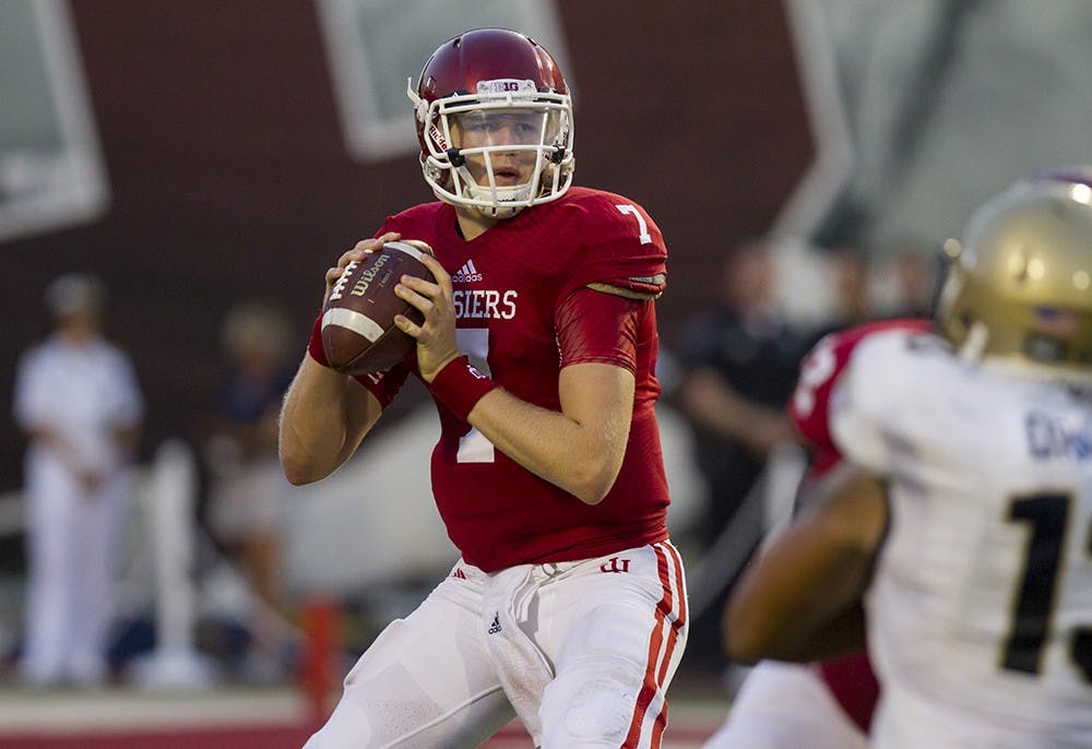 Quarterback Nate Sudfeld prepares to pass the ball during IU's 41-35 loss to Navy on Sept. 6, 2012, evening at Memorial Stadium.