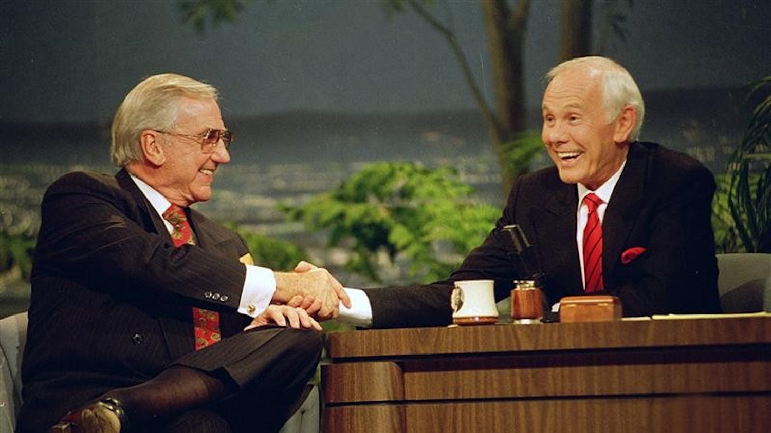 FILE - In this May 22, 1992 file photo, Ed McMahon, left, shakes hands with talk show host Johnny Carson, during the final taping of the "Tonight Show" in Burbank, Calif. McMahon died at a Los Angeles hospital, according to his publicist. He was 86. 
