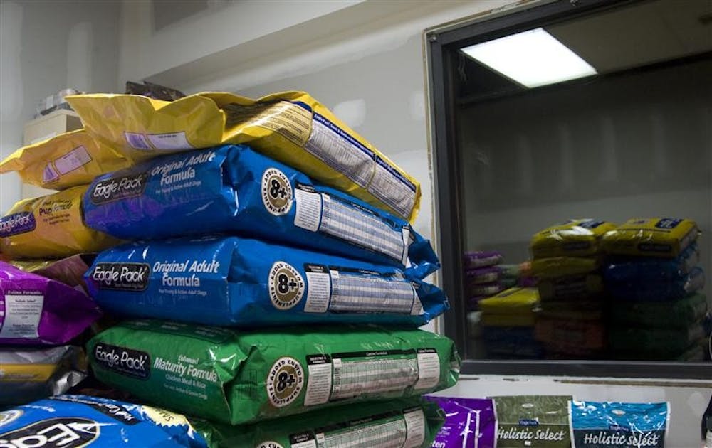 The temporary new location of Delilah's Pet Shop includes a storage room with stacks of pet food bags.  The store reopened today at 1040 W. 17th St. after the former location closed last week due to a fire. 