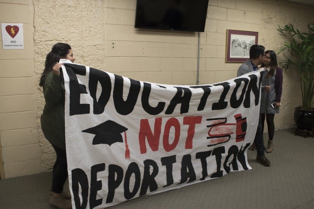 Ball State University students Mari Lynne Cruz, Alex Galan and Erika Espinoza display their banner in support of sanctuary campuses. After trying to display it during the senate hearing, they were immediately shut down by senators.