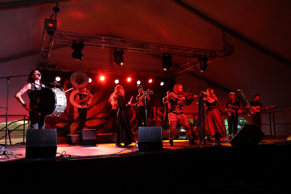 <p>Lemon Bucket Orkestra plays Sept. 24, 2022, at the Sixth Street Tent at the 29th annual Lotus World Music and Arts Festival. The group is a Balkan folk-punk brass band from Toronto.</p>