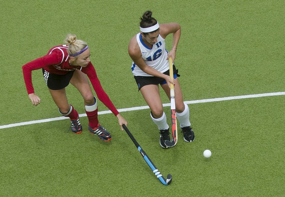 Senior midfielder Corinne Karch defends against Duke defender Alexa Mackintire during IU's game against the Blue Devils on Sunday. IU scored three unanswered points to beat No. 4 Duke, 3-2.