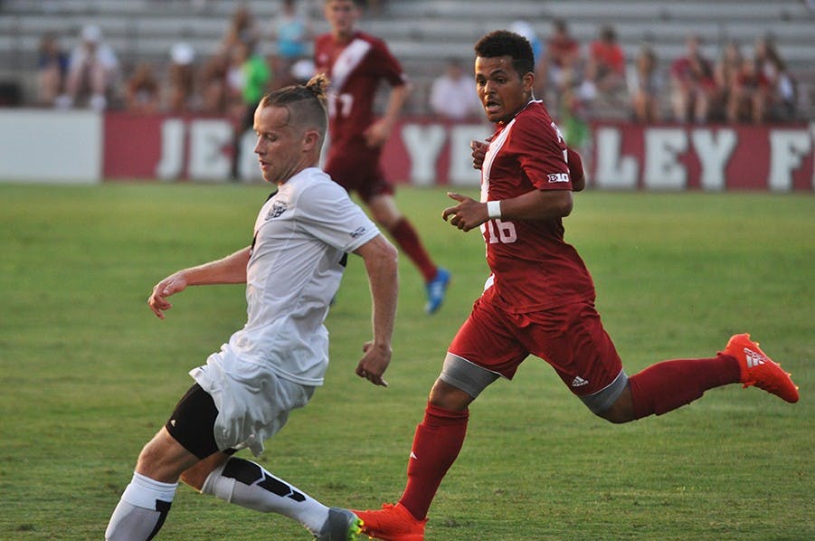 Sophomore midfielder Rees Wedderburn chases down an Oakland player during IU's exhibition game last Thursday.