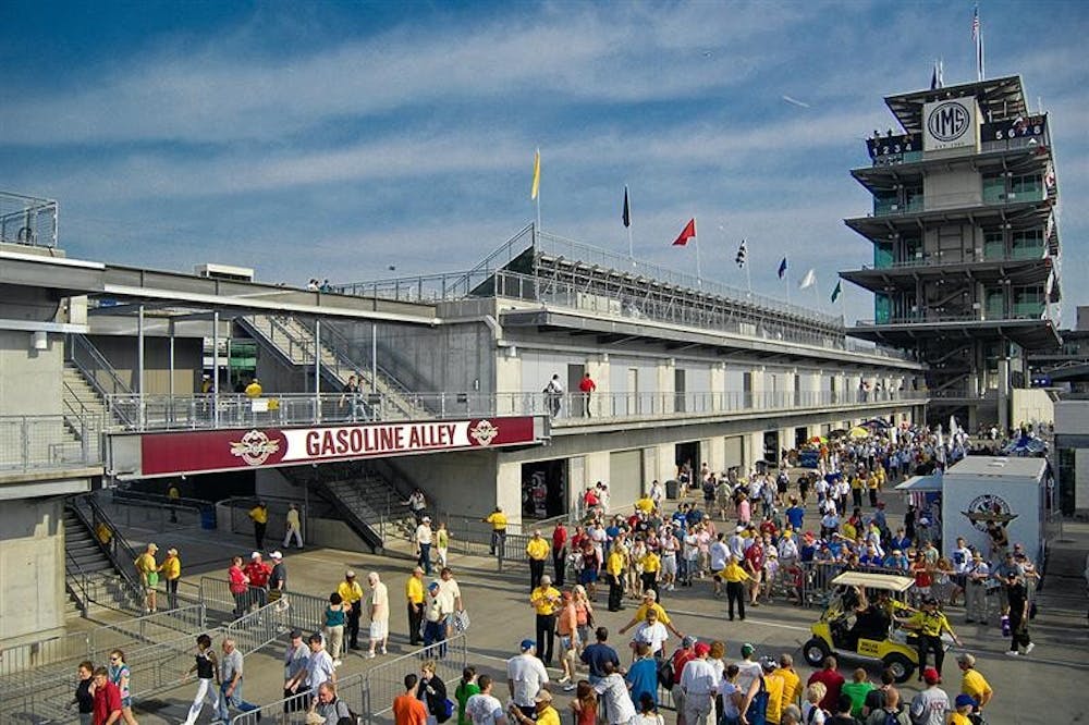 Fans walk along Gasoline Alley prior to the start of Sunday's Indy 500 at Indianapolis Motor Speedway.