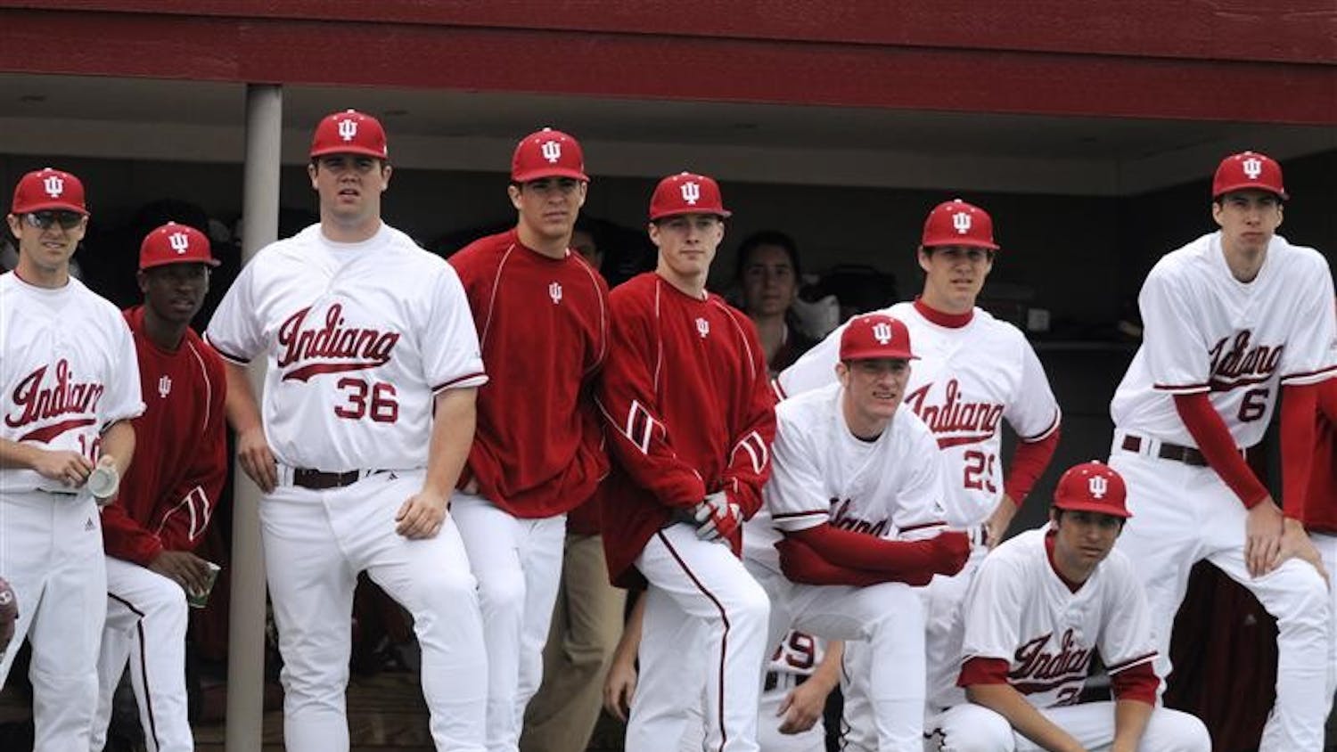 IU players watch the action from the dugout during a game against Minnesota on Friday at Sembower Field. IU lost 12-5.