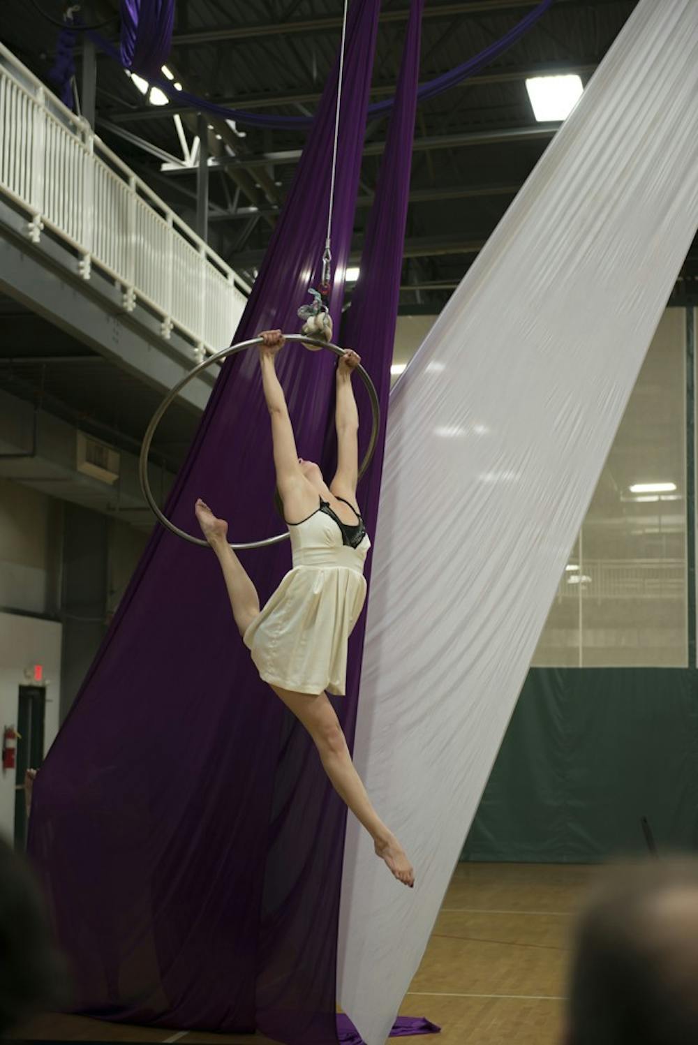 Senior Lexii Alcaraz performs at the Twin Lake Recreation Center on Sunday night in honor of her late boyfriend and IU classmate Brian Maclafferty, 21. “Brian loved me doing aerial and watching me doing aerial,” she said. “I had to send him a picture anytime I had a class. He was really supportive of it. We used to talk about opening a studio, because he liked business and I liked aerial.”