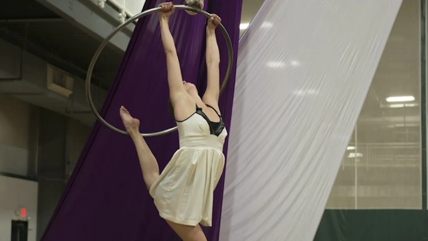 Senior Lexii Alcaraz performs at the Twin Lake Recreation Center on Sunday night in honor of her late boyfriend and IU classmate Brian Maclafferty, 21. “Brian loved me doing aerial and watching me doing aerial,” she said. “I had to send him a picture anytime I had a class. He was really supportive of it. We used to talk about opening a studio, because he liked business and I liked aerial.”