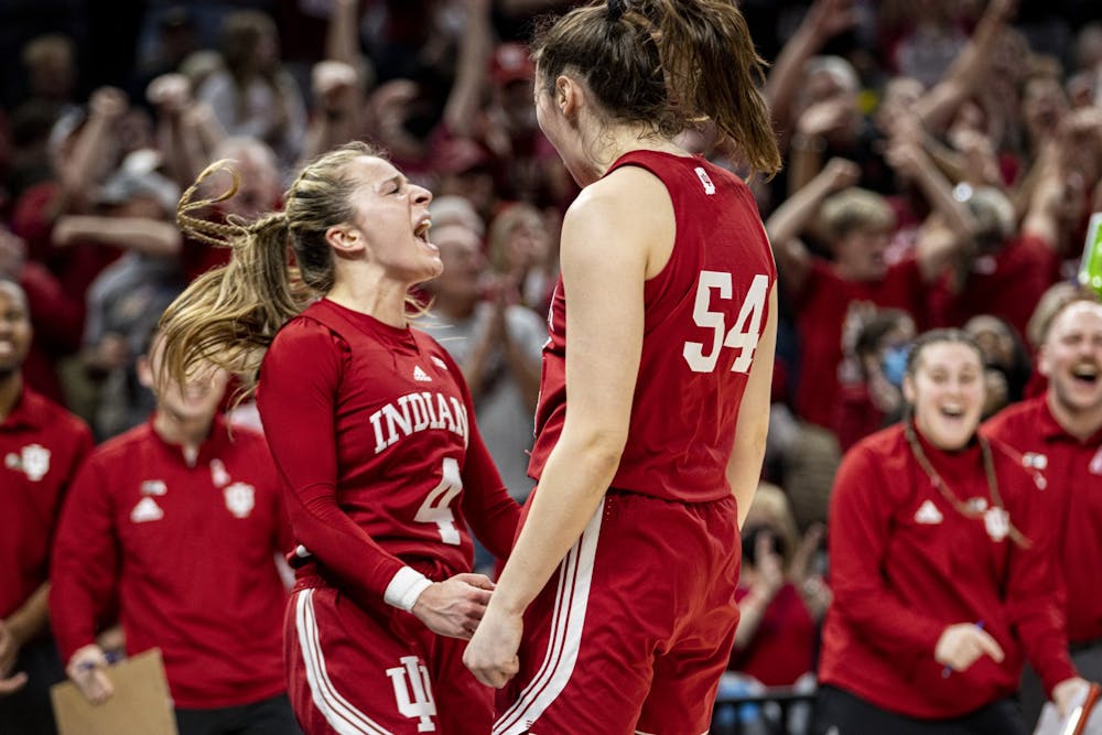 <p>Graduate guard Nicole Cardaño-Hillary and junior forward Mackenzie Holmes celebrate Cardaño-Hillary&#x27;s made layup while being fouled on March 5, 2022, at Gainbridge Fieldhouse in Indianapolis. Indiana beat Ohio State 70-62 to advance to the Big Ten Tournament championship.</p>
