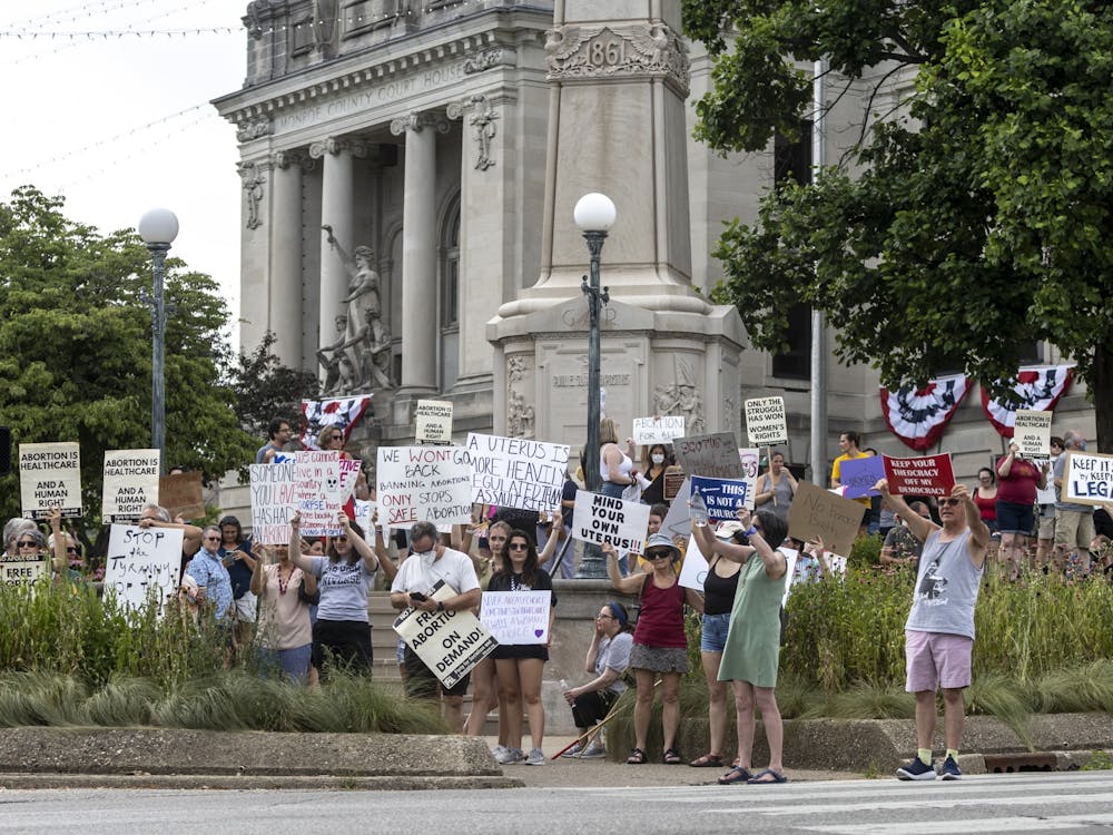 A group of demonstrators stand outside the Monroe County Courthouse on June 24, 2022, protesting in support of reproductive rights. The protest was organized in response to the Supreme Court overturning its decision in Roe v. Wade after nearly 50 years. 