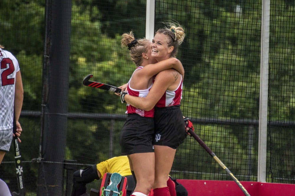 <p>Claire Woods, left, and Ciara Girouard, right, celebrate scoring against Stanford on Sept. 7 after a goal by Woods at the IU Field Hockey Complex. The Hoosiers will play Maryland and Rutgers this weekend.</p>