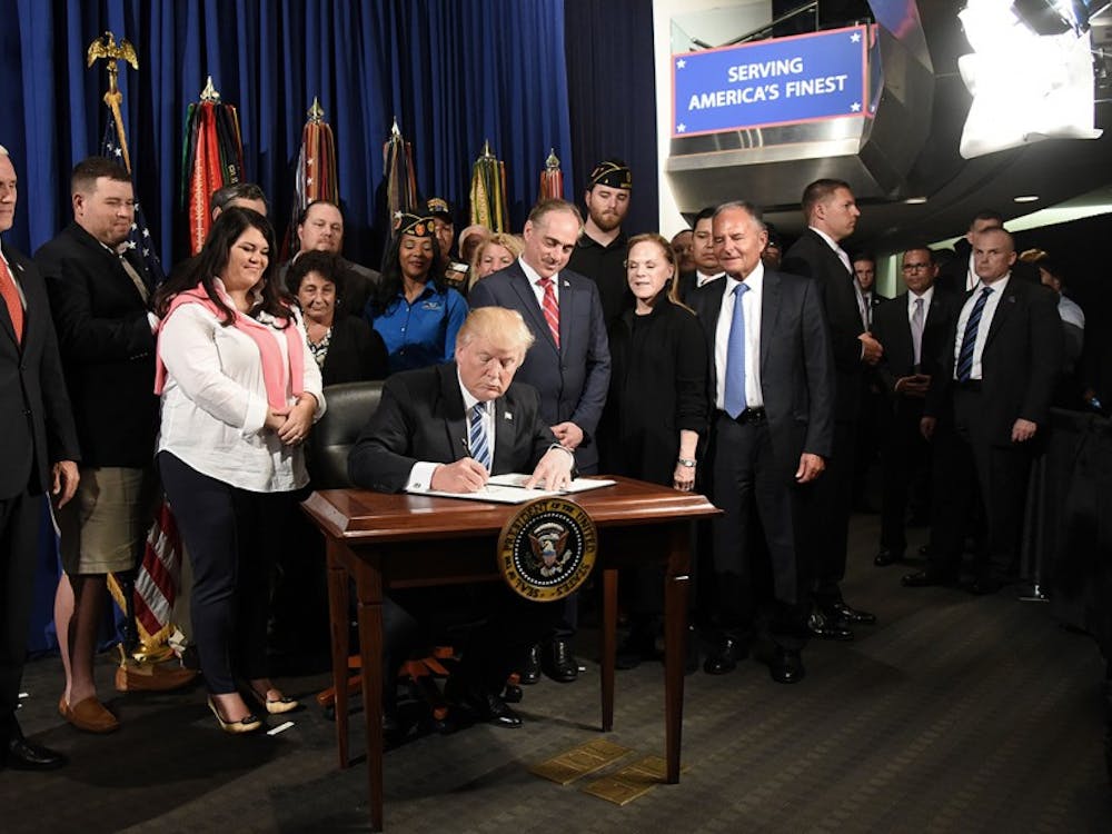 President Donald Trump signs an Executive Order on Improving Accountability and Whistleblower Protection at the Department of Veterans Affairs in Washington, D.C., on Thursday, April 27, 2017. (Olivier Douliery/Abaca Press/TNS) 