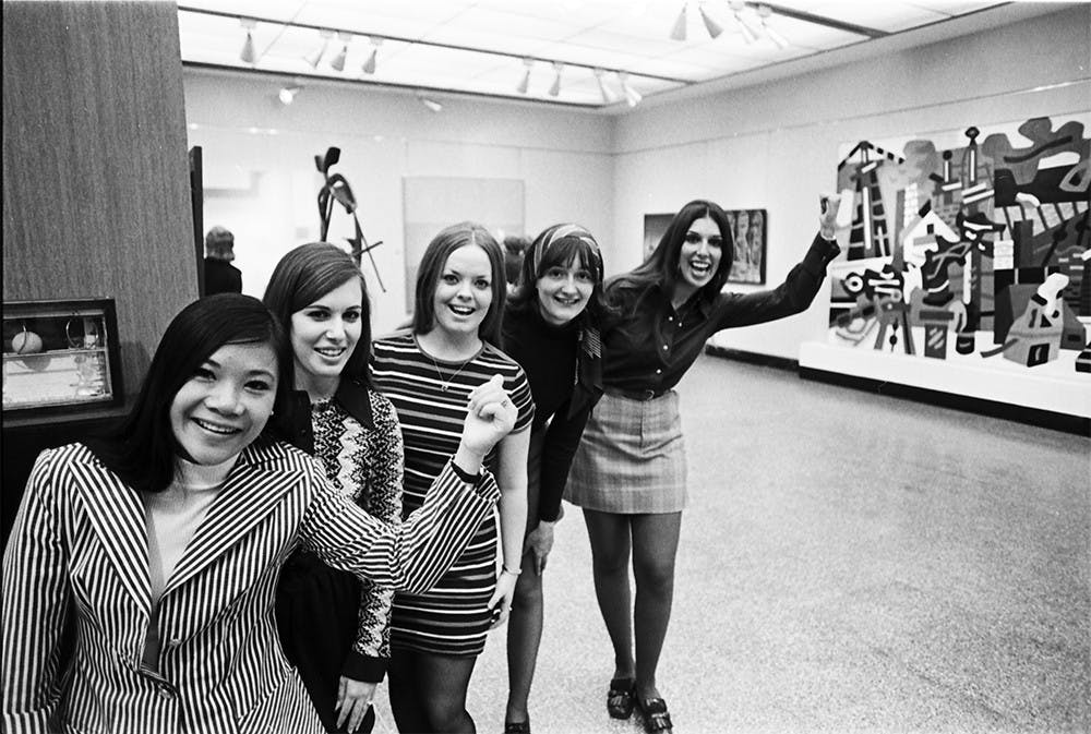 In 1972, five members of the Senior Class Council line up to guide a Women's Day tour of the Fine Arts Building. Though the IU Art Museum was founded in 1941, its present building was not build until 1982.
