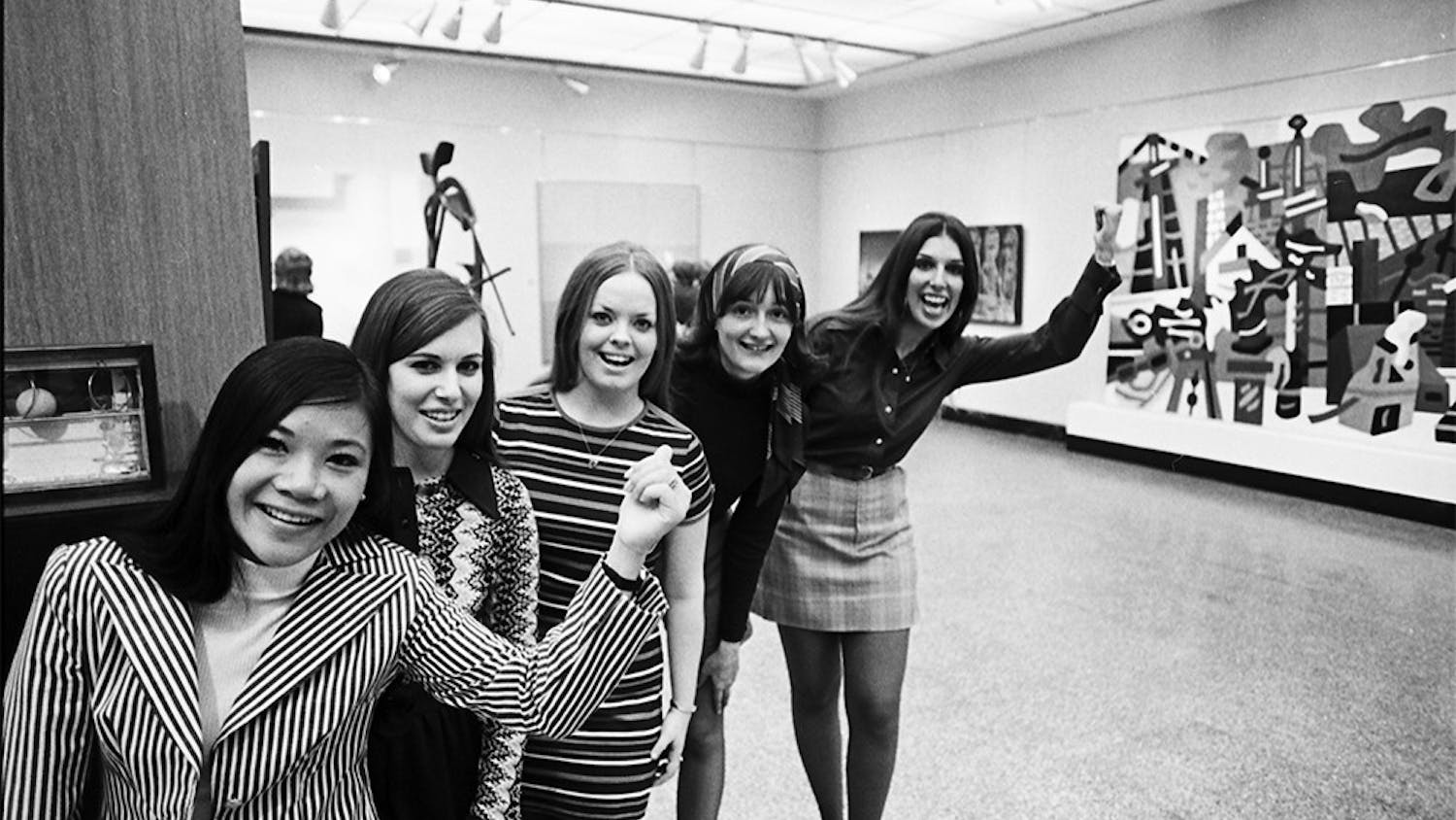 In 1972, five members of the Senior Class Council line up to guide a Women's Day tour of the Fine Arts Building. Though the IU Art Museum was founded in 1941, its present building was not build until 1982.