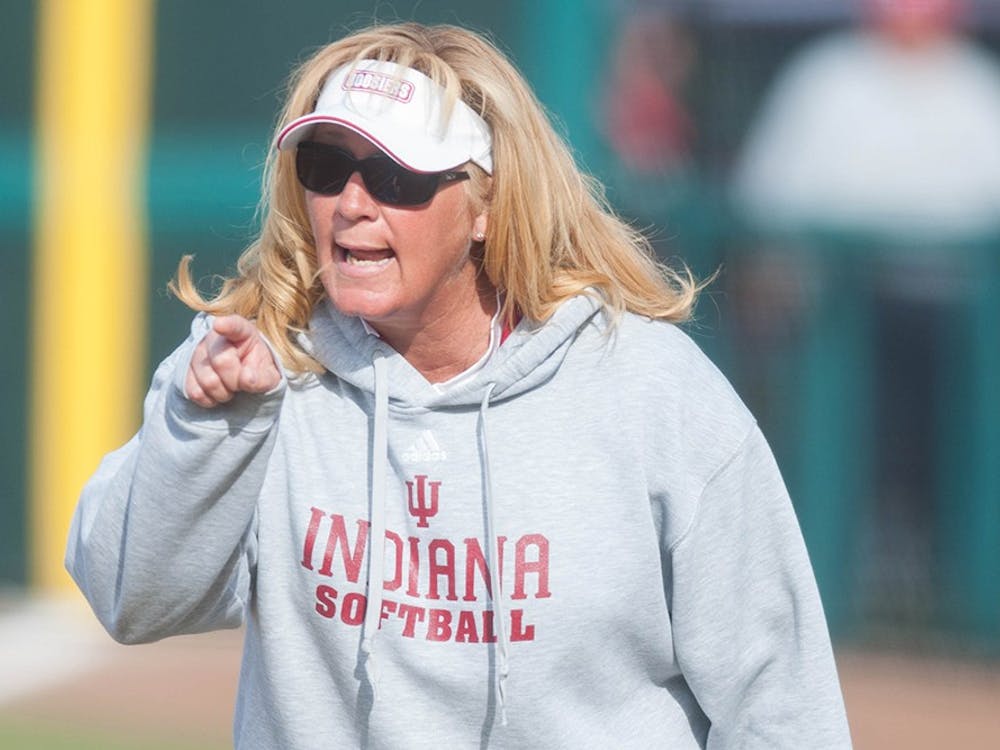 IU Coach Michelle Gardner talks to one of her players during IU's game against Ball State on April 16, 2014 at Andy Mohr Field. Gardner, who resigned as head softball coach in May, was replaced by Shonda Stanton on Saturday.