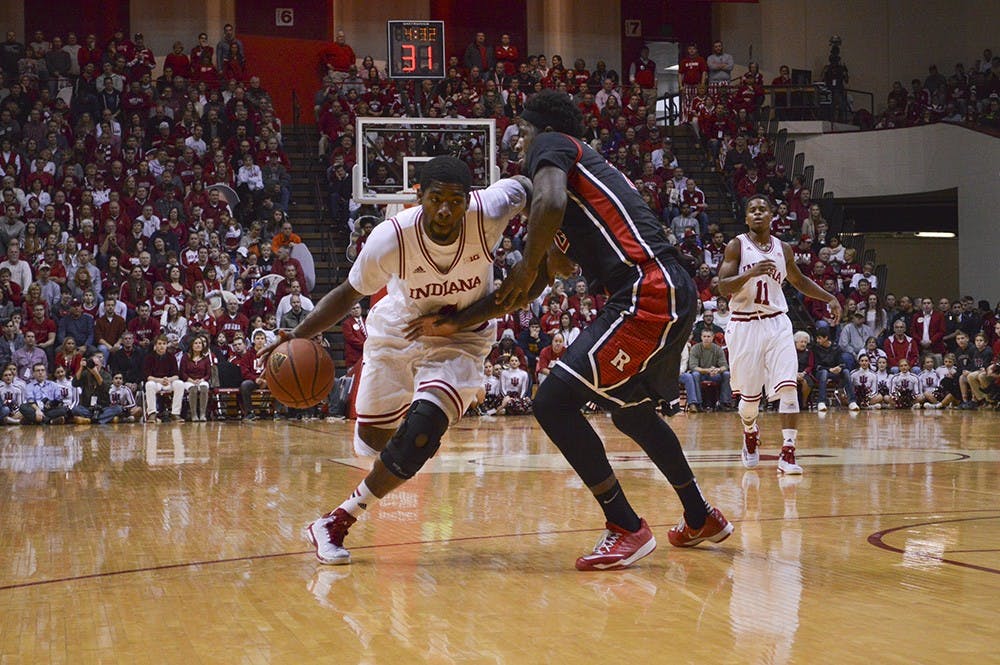 Freshman guard Robert Johnson drives the ball to the basket during the game against Rutgers Saturday at Assembly Hall.