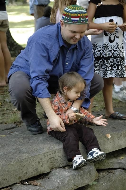Doctorate student Wolodymyr Smishkewych and his son Ilani Smishkewych-Kosovske participated in the Tashlikh ceremony as a part of the Jewish High Holiday of Rosh Hashanah on Tuesday at the Jordan River. The symbolic tossing of the bread is the "casting off" of ones sins. 