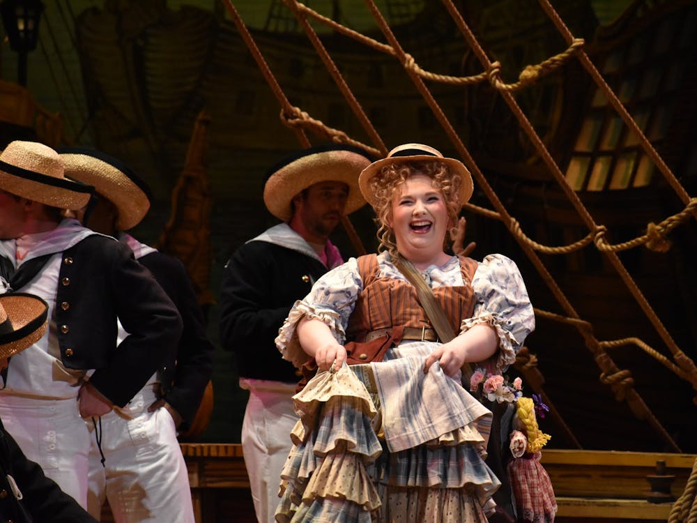 IU junior Shannon Lally dances on stage as Buttercup in &quot;H.M.S. Pinafore.&quot; The opera was written by Arthur Sullivan with a libretto by W.S. Gilbert.