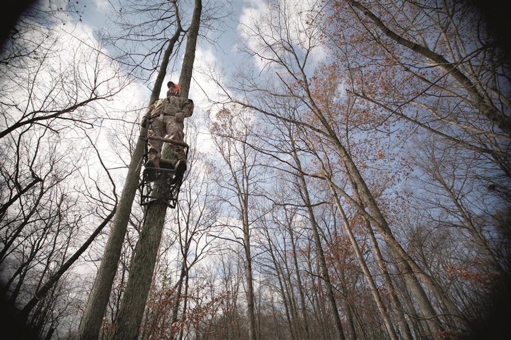 <p>Tyler Kivland stands in his tree climber on a bow hunting trip Nov. 13, 2012&nbsp;in Brown County, Ind. Kivland often spends over ten hours staking out deer. He said that hunting gives him time to think and relax.&nbsp;Public Question 1 on the 2016 ballot will ask voters if they agree the right to hunt, fish and harvest wildlife is an important part of Indiana Heritage in order to add an amendment to the state constitution to protect that right forever.</p>