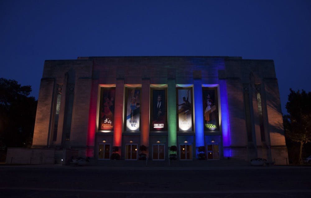 The Indiana University Auditorium lights up in Pride colors as a memorial for the Orlando mass shooting victims on Monday evening.