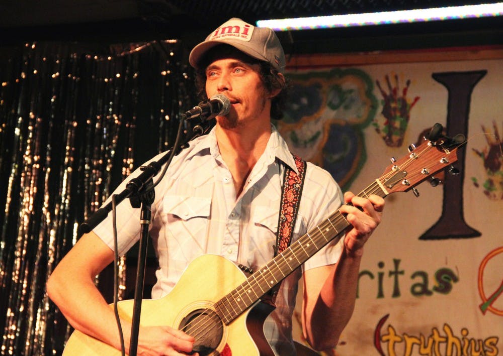Mark Wolven, the lead singer of the Antenna Man, performs Thursday at the Players Pub. The indie rock/alternative country band was formed in 2014 in Indianapolis.