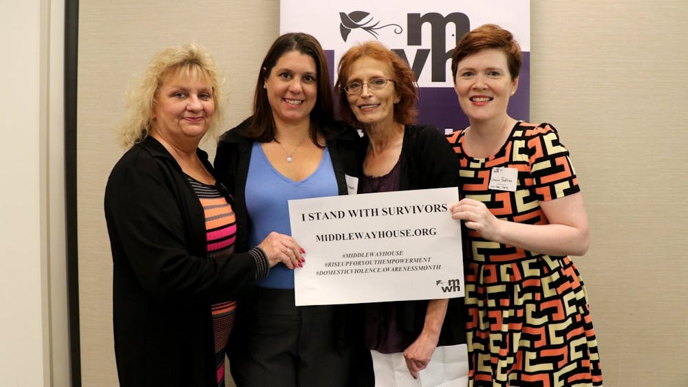<p>Amalia Shifriss (right) poses with three co-workers at a 2019 fundraising event for Middle Way House. </p>