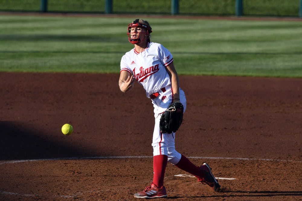 <p>Junior pitcher Tara Trainer pitches against Michigan Friday evening at Andy Mohr Field. Trainer gave up four earned runs and walked five batters in IU's 5-1 loss to Michigan.</p>