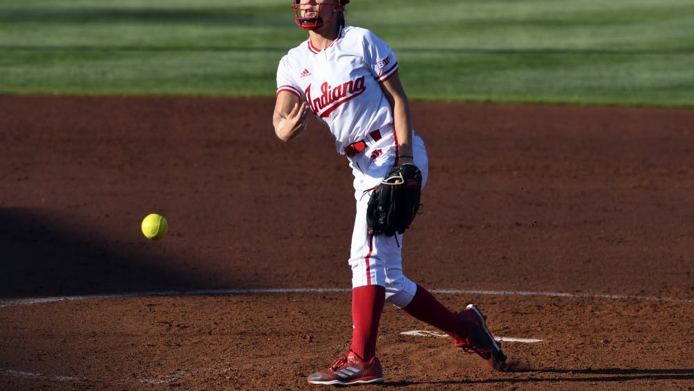 Junior pitcher Tara Trainer pitches against Michigan Friday evening at Andy Mohr Field. Trainer gave up four earned runs and walked five batters in IU's 5-1 loss to Michigan.