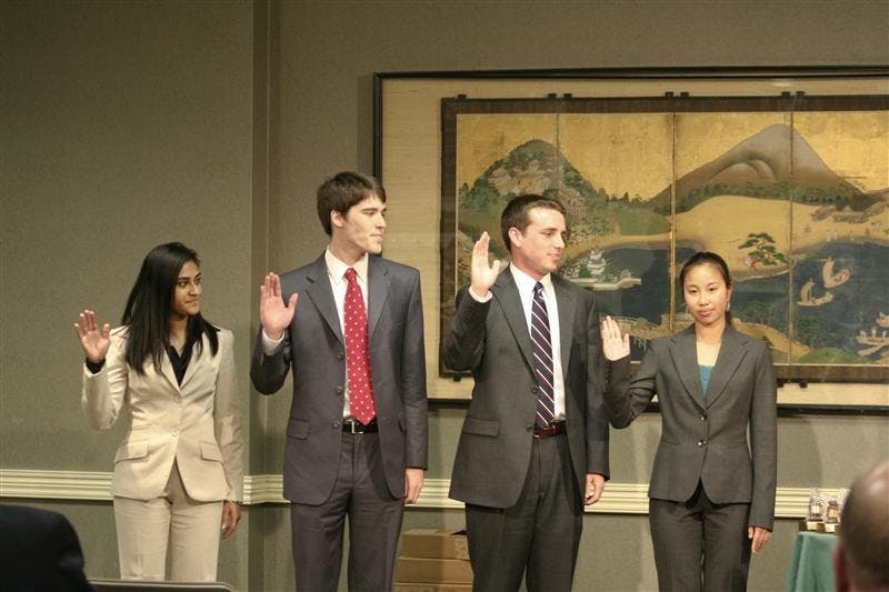 Vice President Shobha Pai, President Peter SerVaas, Vice President Jack McCarthy, and Treasurer Jenn Chen take their oath during the IUSA Inauguration on Monday evening in State Room East of the Indiana Memorial Union. They were sworn in by current Chief Justice of the IU Supreme Court Tara Maloney.