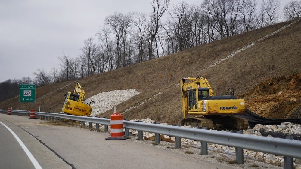 Two pieces of construction equipment sit Jan. 19, 2019, on the side of Interstate 69. State Road 37 in Martinsville, Indiana, closed for construction to convert the road into I-69.