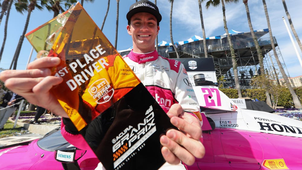 Andretti Autosport’s Kyle Kirkwood celebrates after his first race win April 16, 2023, in the Acura Grand Prix of Long Beach.