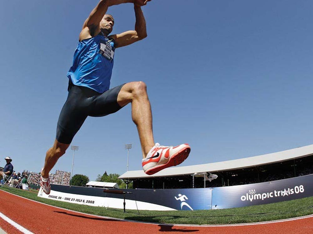Aarik Wilson, winner of the men's triple jump final, leaps towards the sand pit at the U.S. Olympic Track and Field Trials in Eugene, Ore., Sunday, July 6, 2008.  (AP Photo/David J. Phillip)