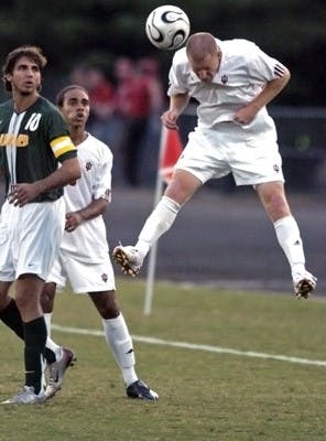 Pete StuttgenIU freshman forward Michael Roach heads the ball as IU sophmore midfielder Kevin Alston and University of Alabama Birmingham junior midfielder/forward Dejan Jakovic watch on Saturday, Sept. 22, at Bill Armstron Stadium. Jakovic scored both goals against the Hoosiers, giving UAB the 2-1 win.