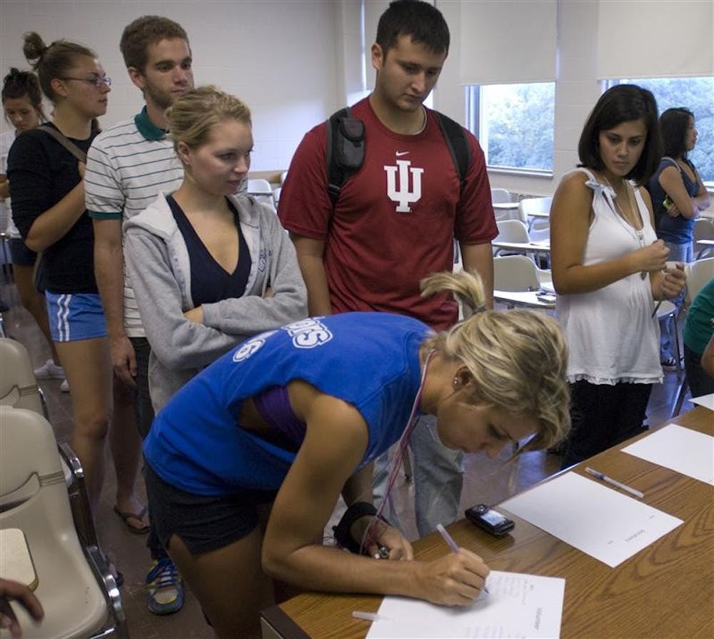 IU freshman Adri Jevtic (left) and junior Elise Smolen (right) sign up to volunteer for IUB Campus Kitchen Project at the student organization's call-out meeting Wednesday evening in Ballantine Hall room 244. Currently in the process of establishing itself, student volunteer organization Campus Kitchens Project plans to save excess food from campus dining halls and prepare it for those in need in the Bloomington community.
