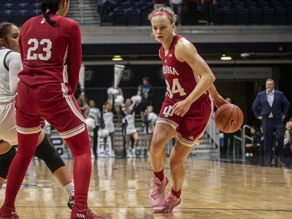 Senior guard Grace Berger dribbles behind her back  on Nov. 10, 2021, at Hinkle Fieldhouse in Indianapolis. Berger scored 21 points in Indiana women's basketbball's win against Ohio State on Sunday in Columbus, Ohio.