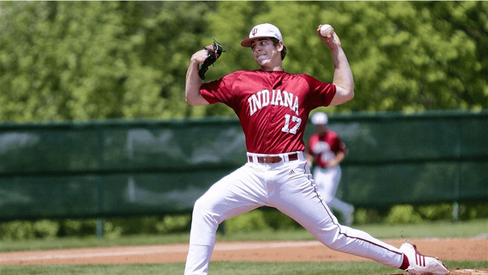 Freshman Blake Monar delivers a pitch against Northwestern Sunday afternoon at Sembower Field. The Hoosiers defeated the Wilcats 11-2.