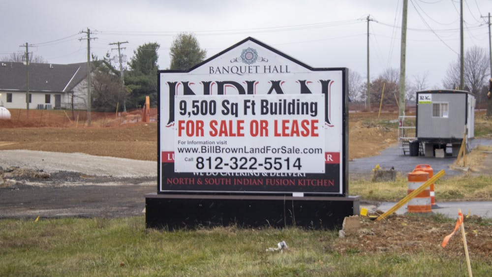 A &quot;for sale&quot; sign is seen Nov. 16, 2022, on East Third Street. The housing market in Bloomington has slowed since the rise of interest costs. 